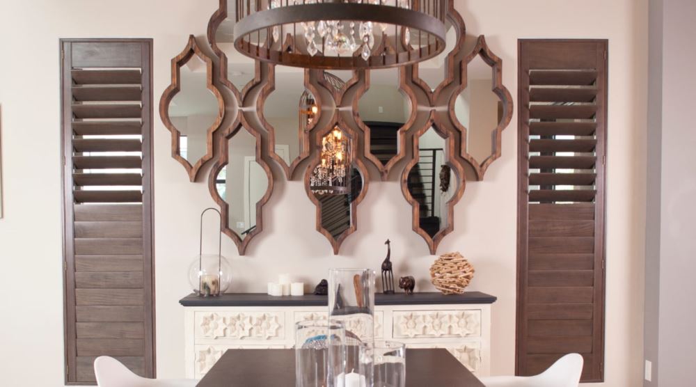 Natural wood shutters will compliment hardwood floors and trim. Ovation shutters in a dining room.