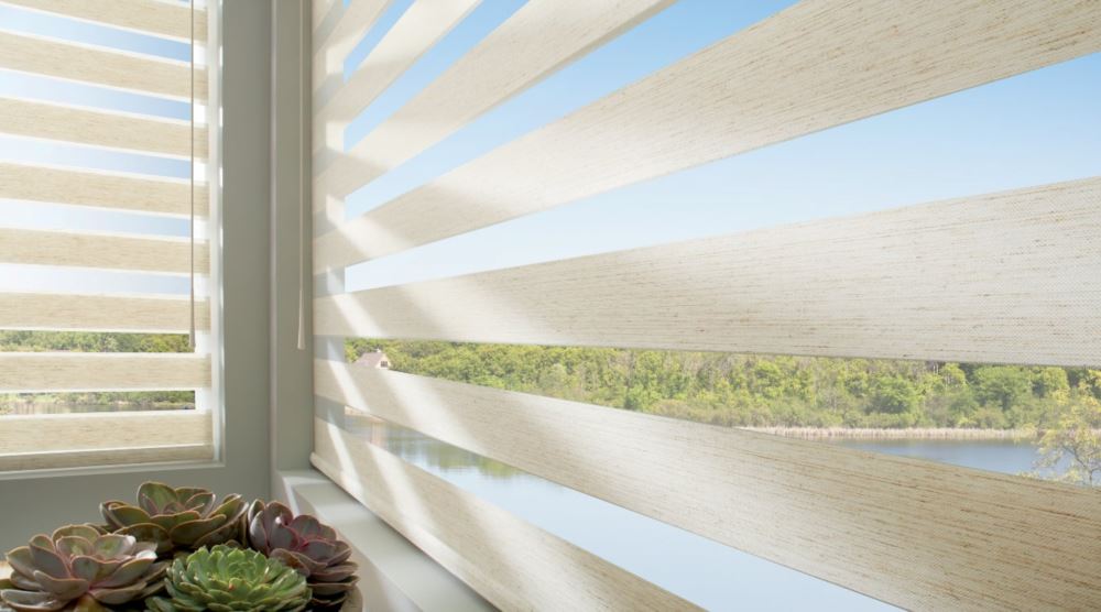 Sheer shades have wide slats which make them easier to clean. Sheer shades in a window