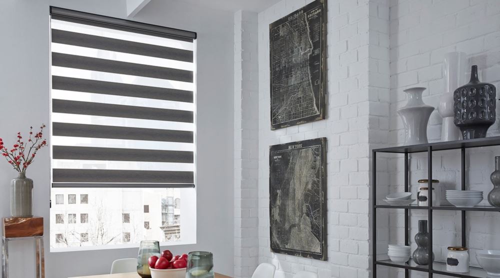 Zebra shades can block out noise and other distractions. Zebra shades with a table.