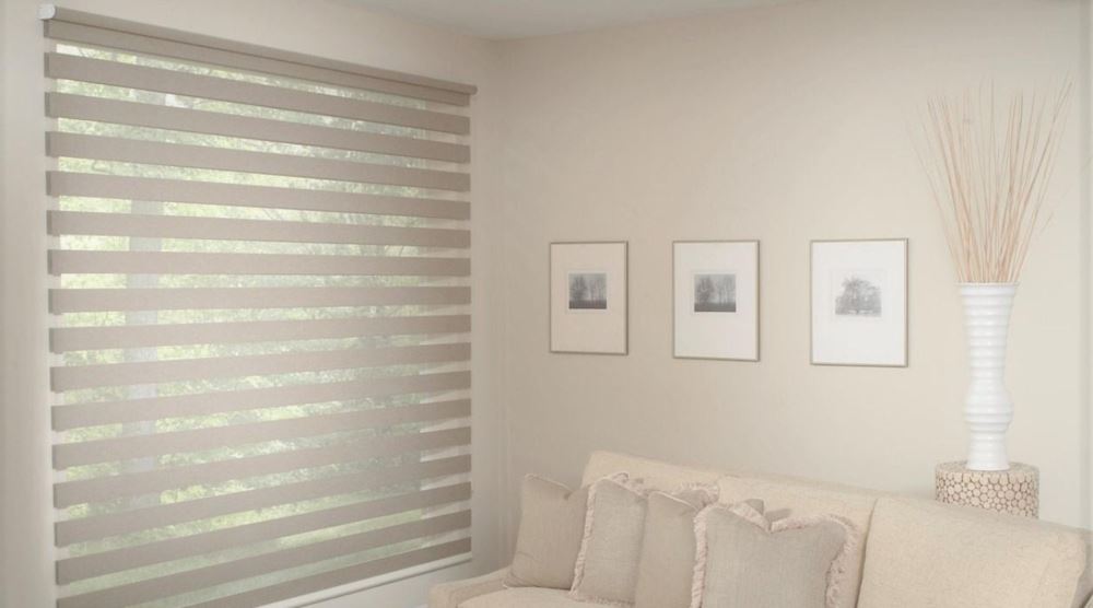 Zebra shades come in many custom sizes and can fit most specialty shaped windows. Zebra shades in a sitting room