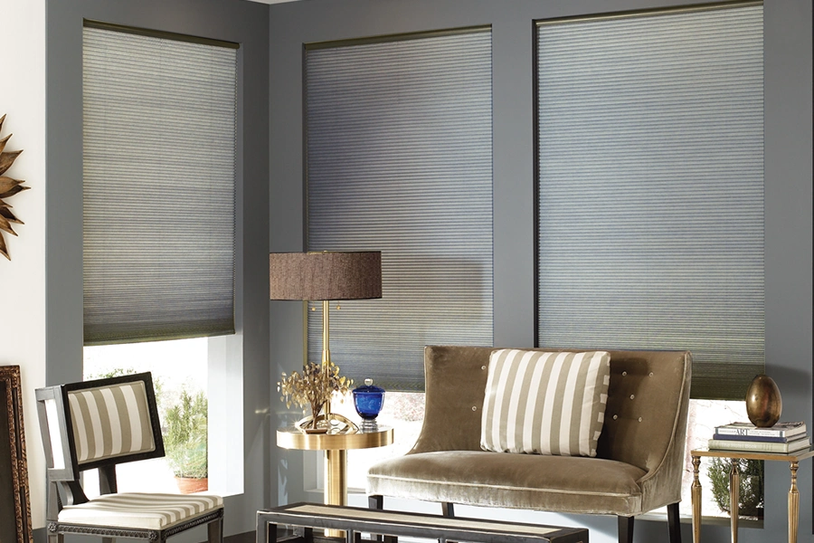 Once you know you want blackout shades, all you have to do is pick the style and color that suits your home best! Gray blackout cellular shades on living room windows