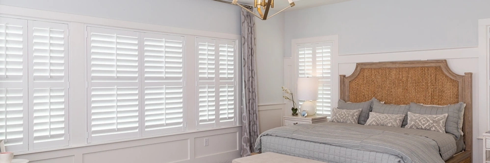 Closed blackout Polywood shutters on bedroom windows