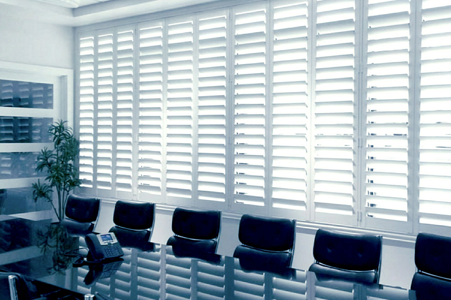 White Polywood shutters adds class and elegance to a business boardroom. Boardroom with white polywood shutters