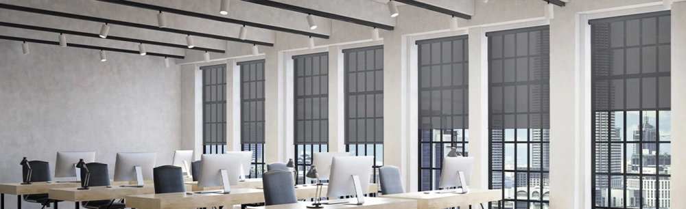Gray window shades on tall office windows