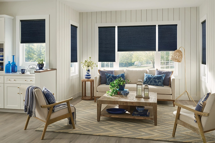 Navy blue roller shades in a modern beach decor living area