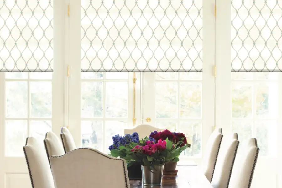 Patterned window shades on dining room windows