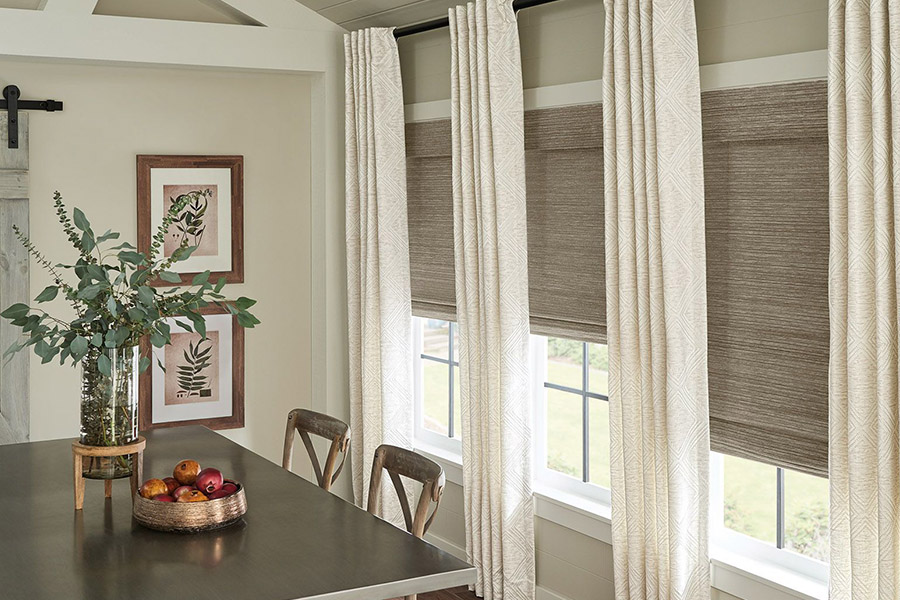 Elegant woven fiber window shades dress up your windows and dining room. woven shades in a dining room