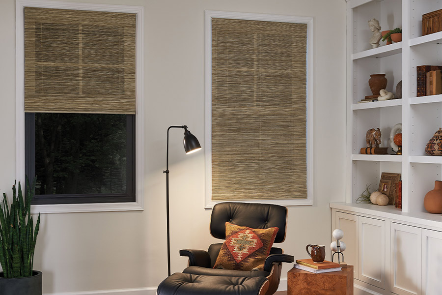 Woven fiber shades add a touch of nature and natural light to your home. Tan woven fiber shades on den windows