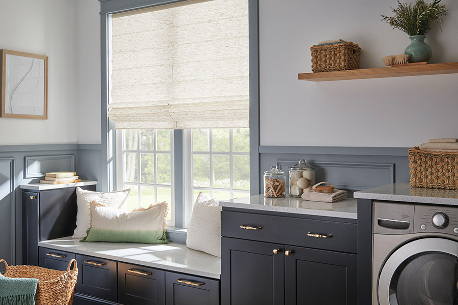 Roman shades give your laundry room window some style and you privacy. A laundry room with washing machines