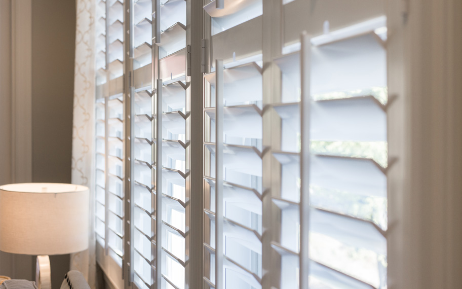 Close up of white polywood shutters.