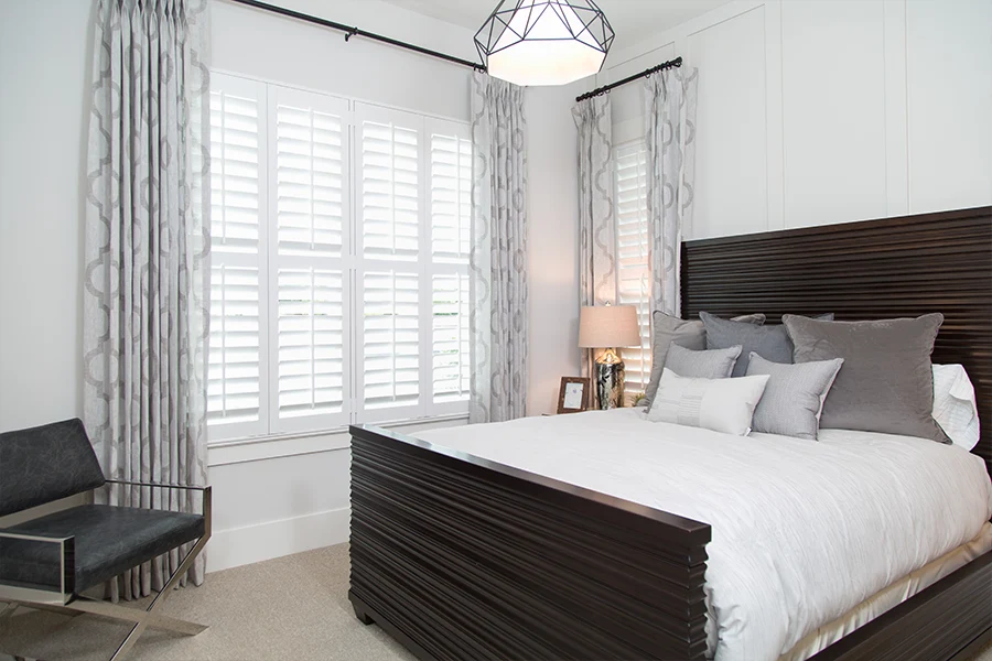  Polywood shutters and drapes on bedroom windows