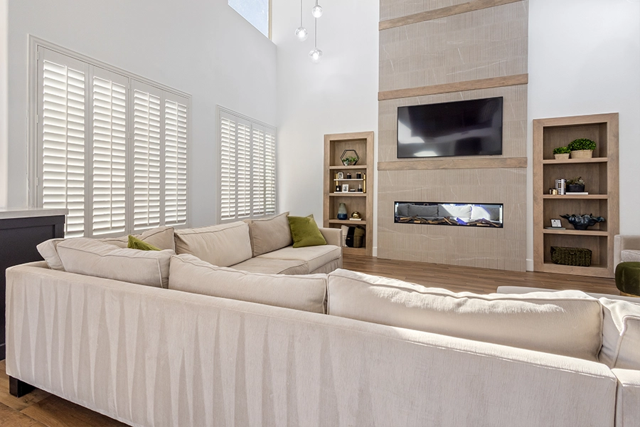 Use window treatments to block sun glare in west-facing rooms. Polywood shutters on large living room windows