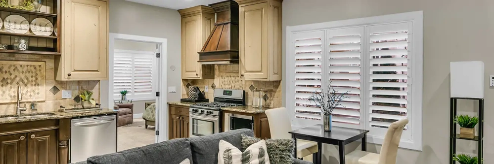 Polywood shutters on large windows in the kitchen and den