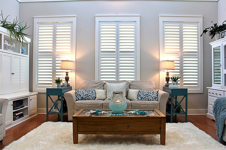 No window treatment keeps your home warm as well as Polywood shutters. Polywood shutters on three living room windows